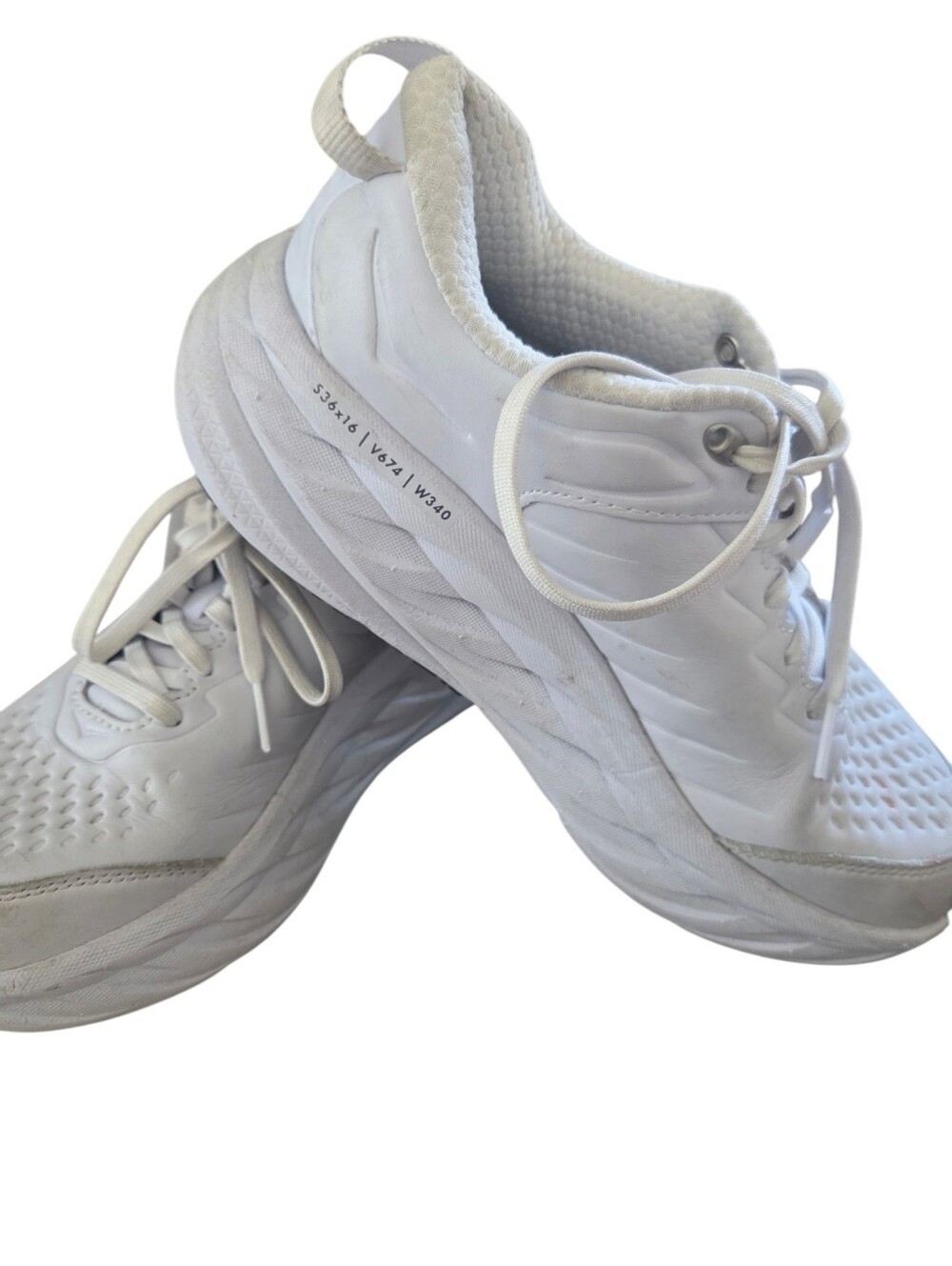 Hoka Bondi SR White Lether shoe with white laces and a thick, cushioned sole.